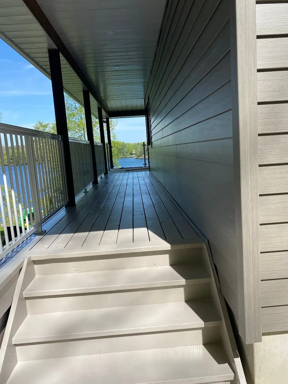 covered porch with abs railing and pvc decking